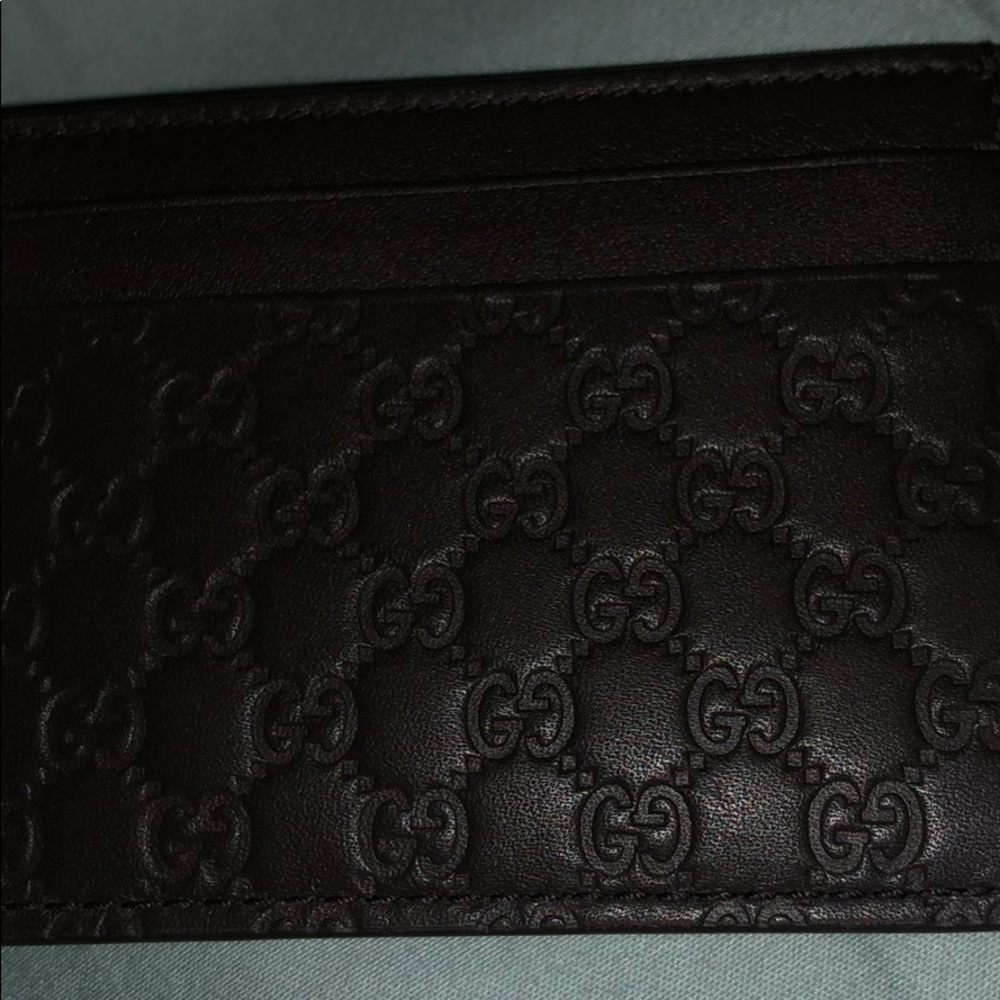 Men’s dark brown Gucci wallet